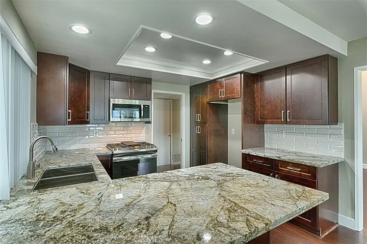 Brand new kitchen cabinets, gorgeous granite counters with subway tile back-splash.