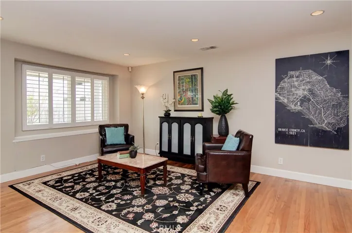 Front sitting room can be a pleasant hang out away from the great room action...or could be a formal dining space or music room...you choose...it's flexible!  The box window and shutters add nice detail too.