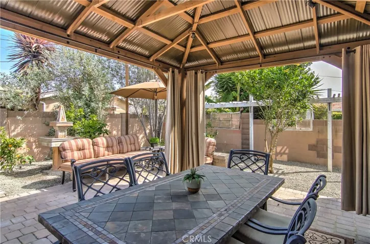 WOW! This is a major dining pavillion...all year round...close the drape panels in the winter to create a cozy outdoor dining room in any weather...flexibility is the name of the game at this amazing home!