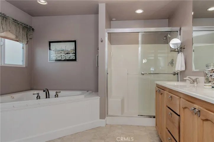 Master bath is the perfect retreat with jetted spa tub, large shower and dual sink vanity...separate commode area too.