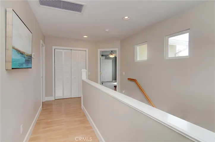 This upper level gallery offers a wonderful transition between bedroom wings and is the perfect location for the inside laundry room.