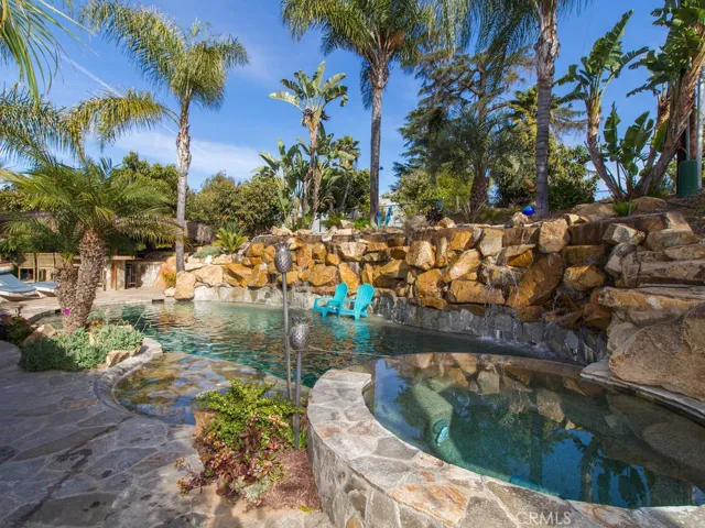 8 foot high Waterfall (cascading over Natural Stone) running the length of the Saltwater Pool