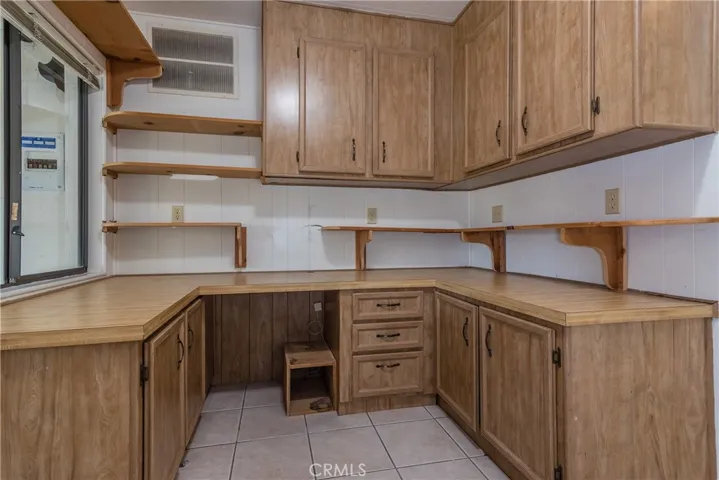 Built in cabinets and shelving make for a great office