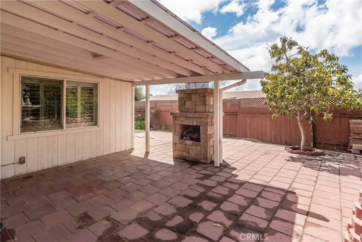 Covered area great for hosting a shaded backyard BBQ