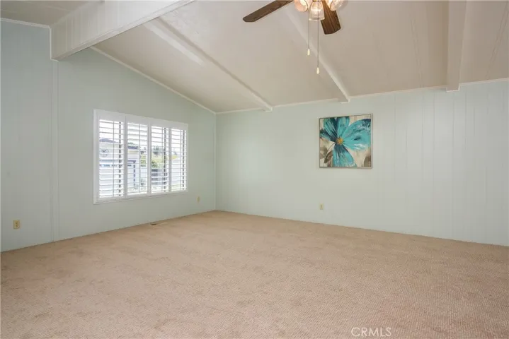 Vaulted ceilings and lots of natural light in this large, open living room