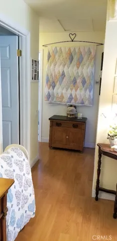 Hallway to bedrooms. Linen cabinet is also located in hallway.
