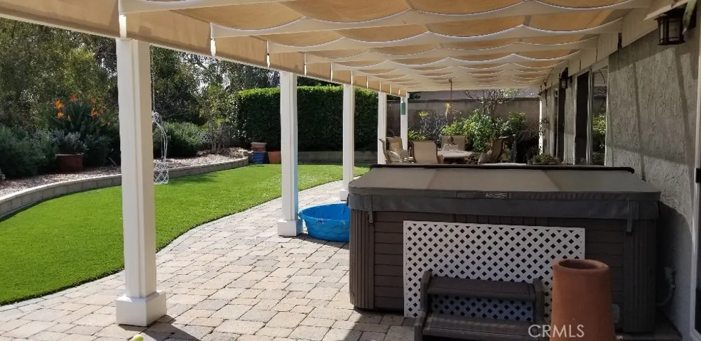 Spa and beautiful pavers that surround the entire yard.