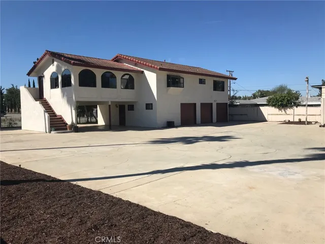 Most living area is on second floor. Downstairs includes a 3 car garage and a 2 space car port. Large staircase leads to second floor entry. Large lot for entertaining, and additional parking etc.