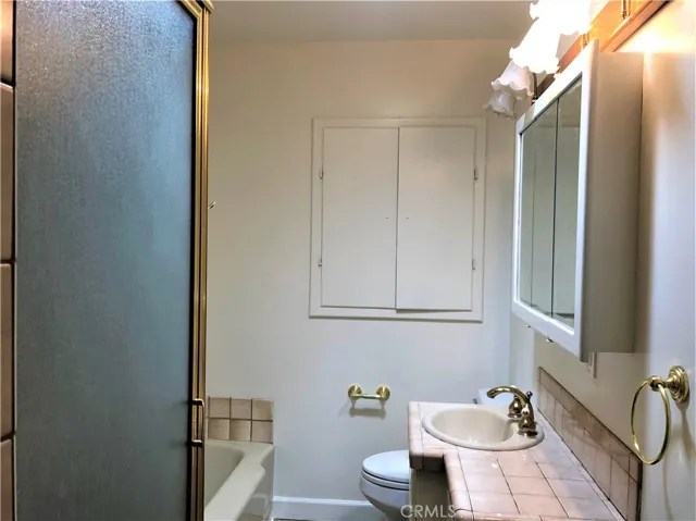 Bathroom with tub and shower
