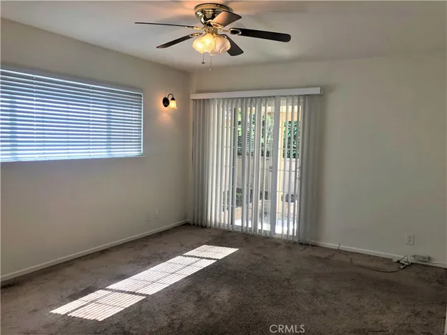 Master bedroom with back sliding door to patio