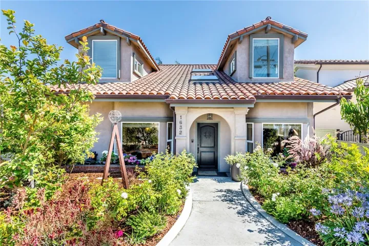 Lush entry way leads to the home.