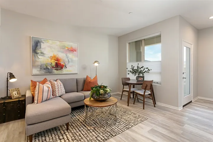 The bright Great Room opens to both the private deck and contemporary kitchen.