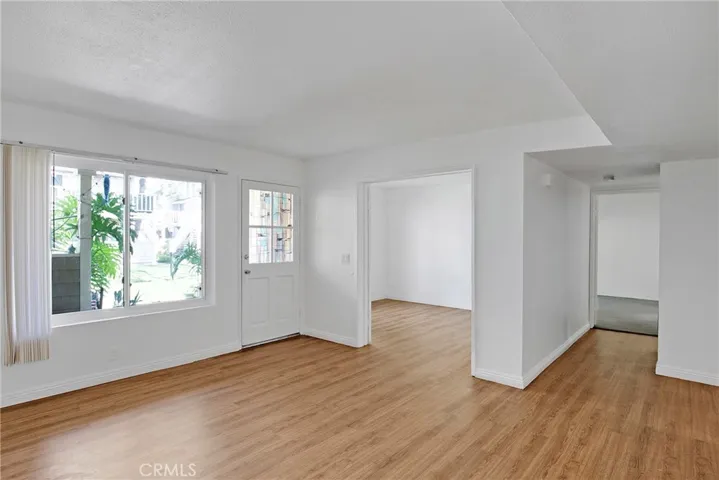 Living room with view toward third bedroom.