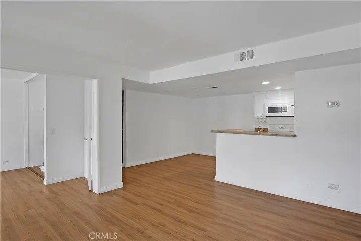 Living room with view toward dining area.