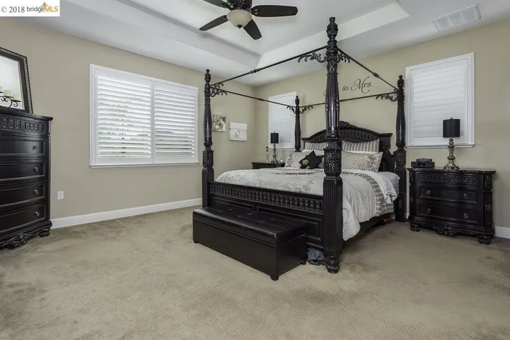 Plush Carpeting, decorative Ceiling fan, Plantation Shutters