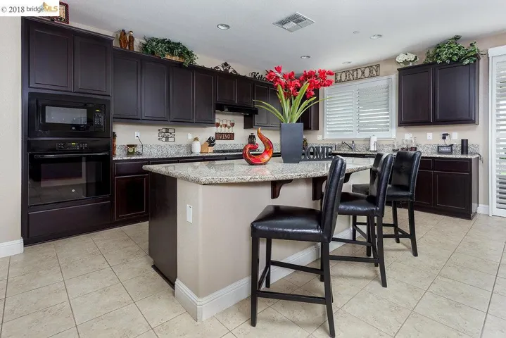 Granite Slab Counter-tops, Expansive Kitchen Island, Spacious Pantry, Tile Flooring