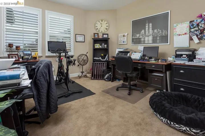 Spacious Bedroom with Plush Carpeting & Plantation Shutters