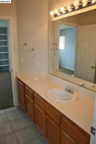 Jack & Jill bathroom with access from bedrooms 2 & 3.  Shower over tub & separate sink area.