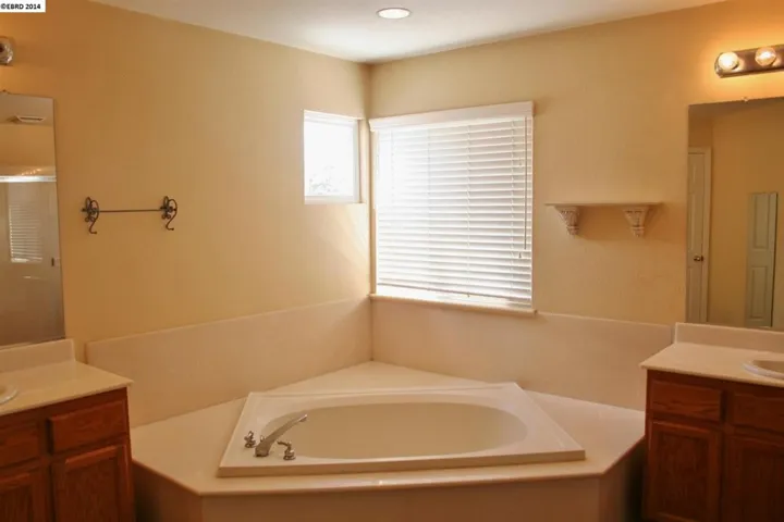 Large & features large soaker tub as well as large stall shower.  Dual vanities.