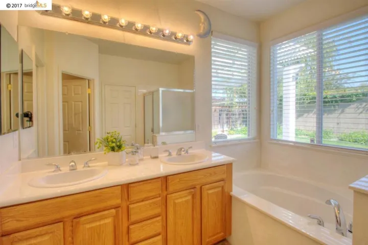 Great bathroom with dual vanity, stall shower & soaker tub!
