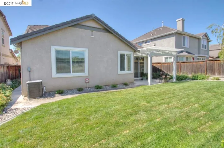 Great back yard with nice lawn & border areas, no rear neighbors!