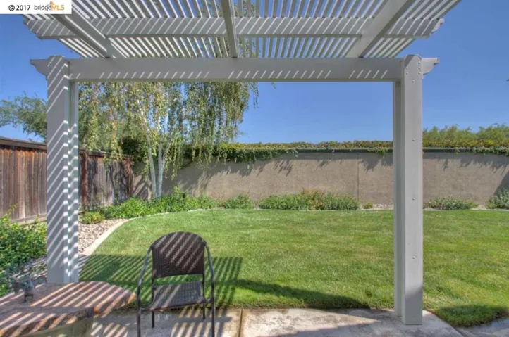 Very nice Alumawood shade structure over patio & nice yard!