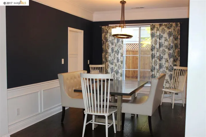 beautiful dinning area with wainscoting