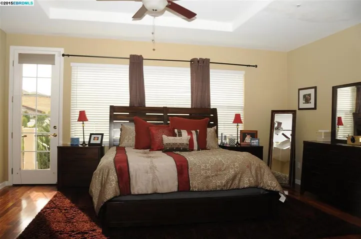 Has large attached balcony with golf course and hill views.