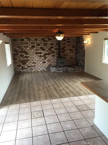 Den w/custom tile work and new vinyl-laminate flooring.