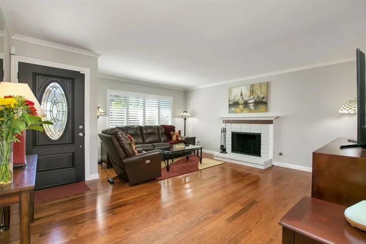 Hardwood floors, new windows, new can lights and fireplace