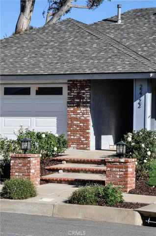 Brick walk up with proper outdoor lighting.  The outdoor lighting and the front door light are on a timer.