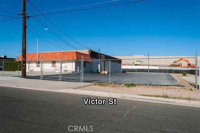 Victor Street view showing the new Walmart Super Center being constructed adjacent behind the property.