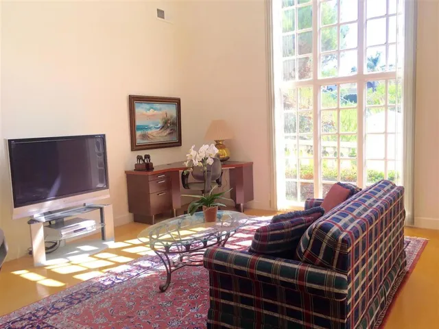 This area can be used as a sitting family room area or a dining area.  Large skylight above!