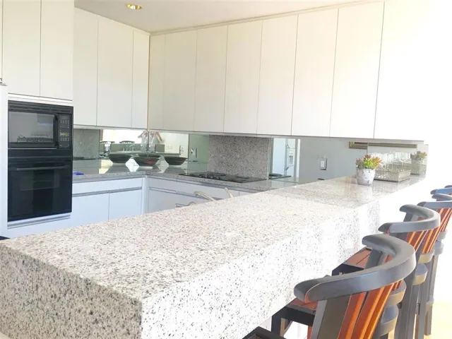 Kitchen offers granite counter tops, marble flooring lots of cabinets and brand new stainless refrigerator.