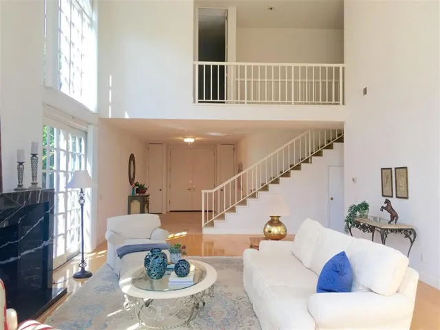 Looking from the living room to the front door entry.