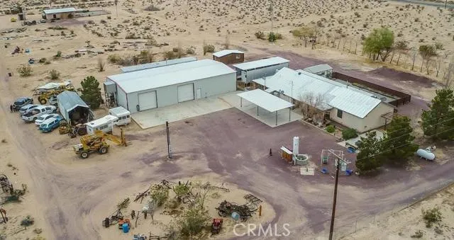 Aerial photo above the house and shop. You can just barely see the little house in the top left corner.