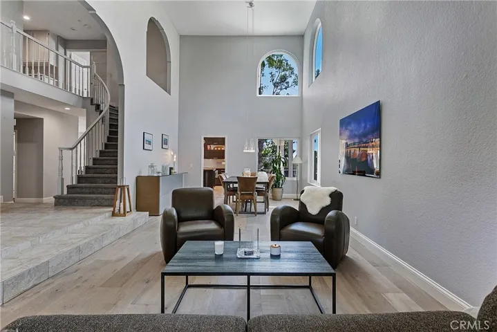 Architectural features such as high ceilings and a variety of arched and standard windows are designed to create a voluminous light-n-bright floor plan. The dramatic staircase is a perfect prop for capturing photos of life's significant moments.