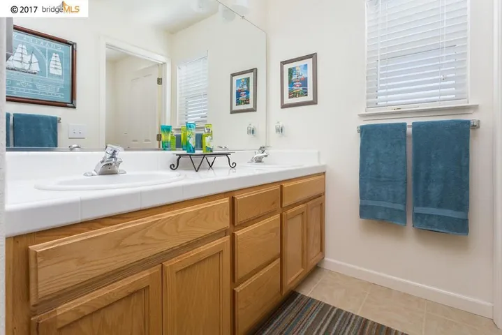 Dual Vanity Sinks, Tile Countertops, Tile Flooring