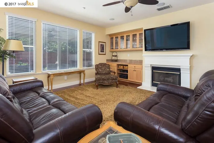 Gas Burning Fireplace, Surround Sound and Built in Cabinets