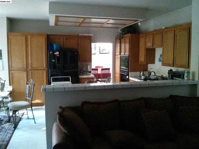 Kitchen with in kitchen Breakfast area over looking back yard.