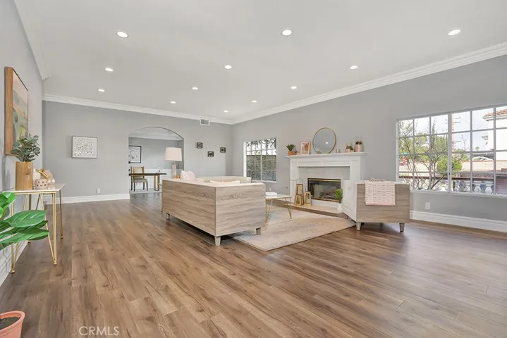 Living room with fireplace, recessed lighting and entrance to office/library/game room