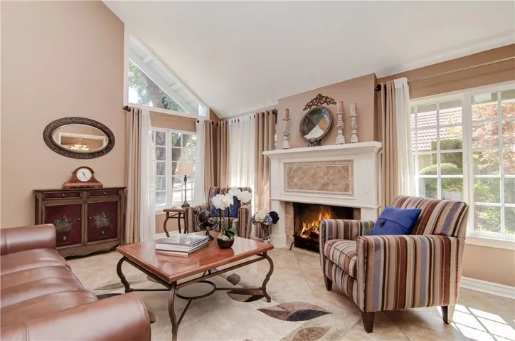 Formal living room with tall ceilings and tons of great natural light pouring in.