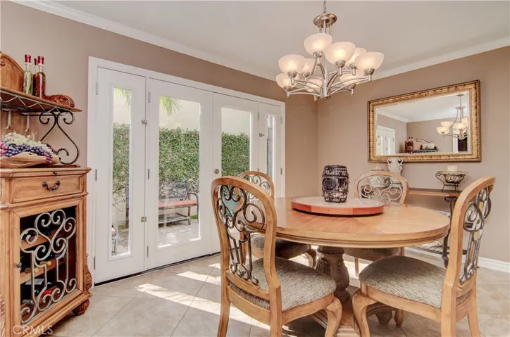 Separated dining area with its own French Doors that lead out to the side yard.