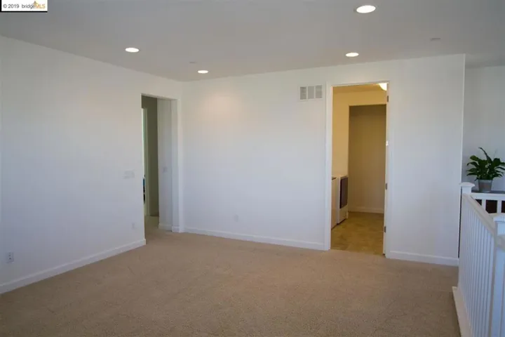 view of laundry room from loft. Watch TV and do the laundry :)