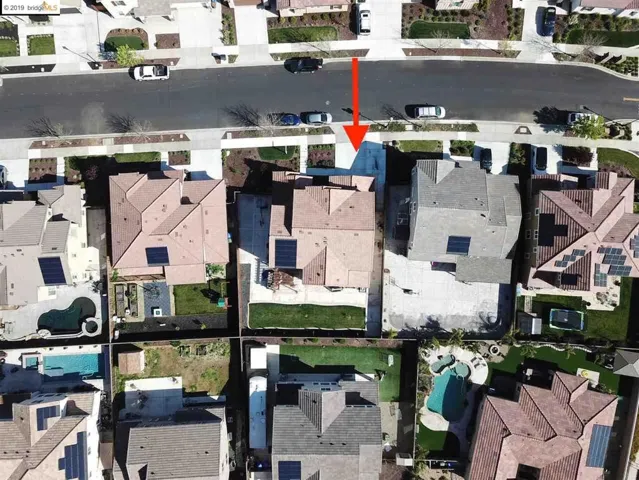 with wide side yard on the left hand side.