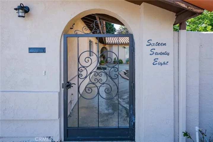 Enter through the gate to the gracious courtyard.