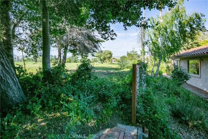 The Laguna Lake Golf Course is in your backyard and while a few balls occasionally find their way into the yard, there has never been a broken window in all the years this seller has lived here! It was purchased by a family member in 1995.