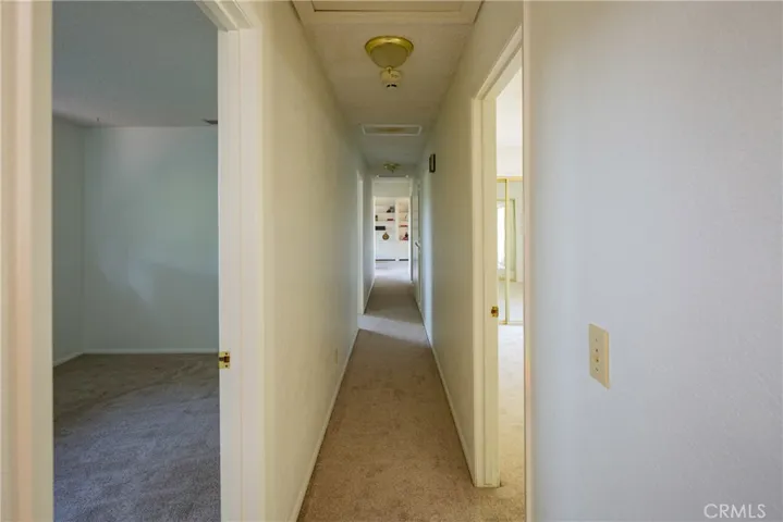 looking down the hall, the bedroom to the right is the master with an attached bathroom.
