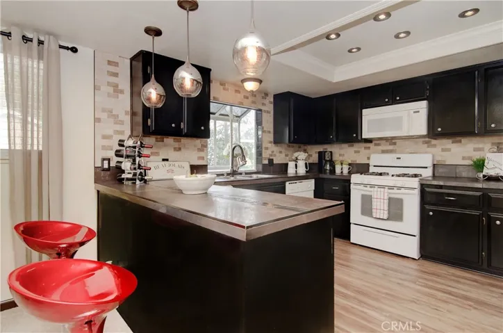 Cool, urban vibe in this huge kitchen that has loads of cabinet and counter space.