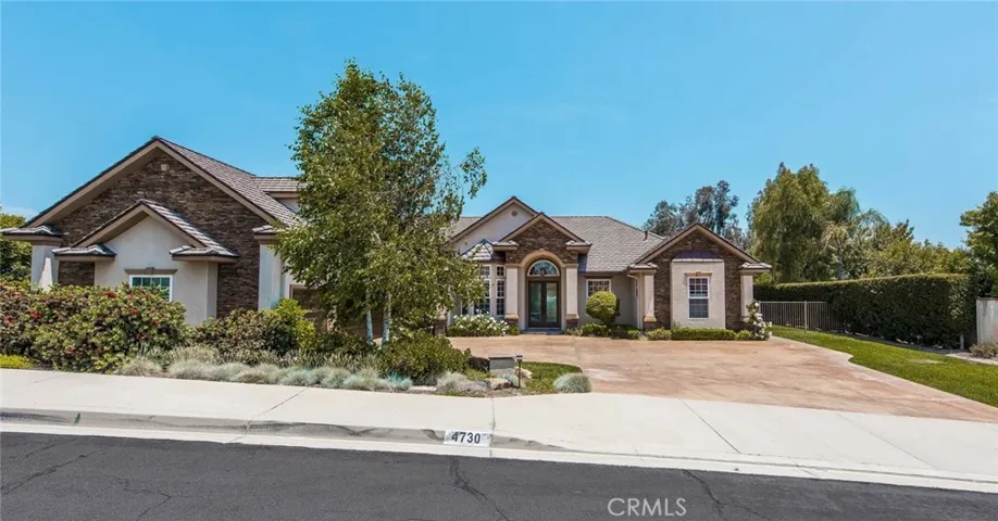 Live the single story life in this two story home.  The entire home is in one level except one Large Bedroom with bath which is above the three car garage.